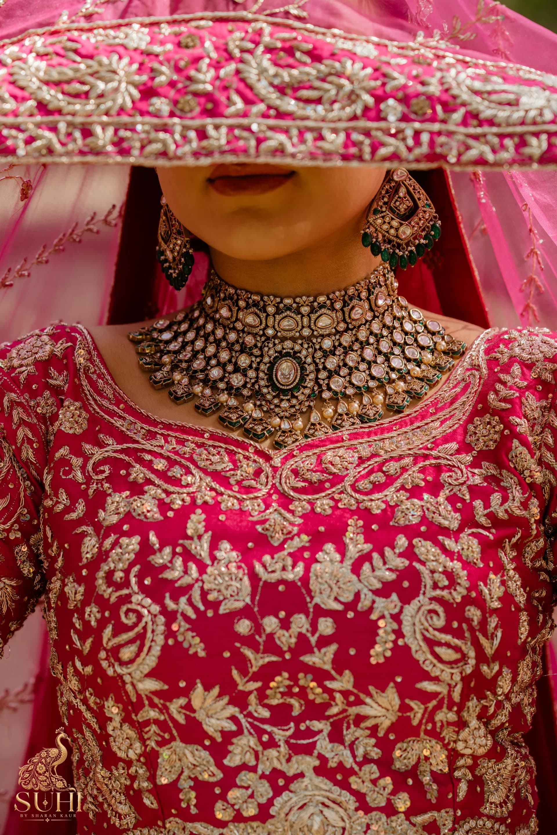 Close view of the RAANI GUL blouse neckline and antique-gold floral embroidery